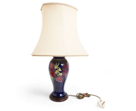 Moorcroft baluster form table lamp decorated in the Anemone pattern, on blue ground, with shade, H36cm excluding fitting