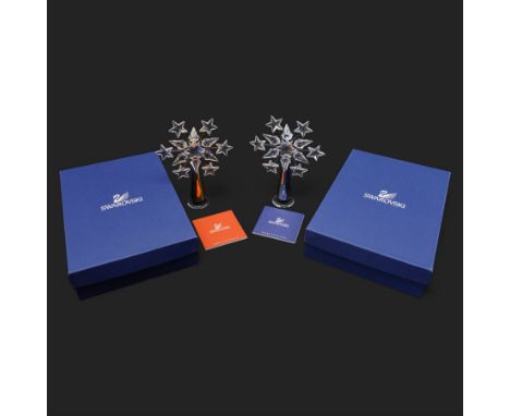 Two Swarovski crystal tree toppers, in gold and silver finishes, boxed (2)