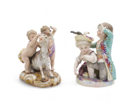 Meissen porcelain group modelled as two cherubs playing with a goat, the oval scroll moulded base heightened in gilt, blue cr