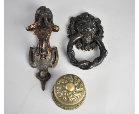 A Cast Iron Door Knocker, Cast Iron Lion Mask Ring Pull and a Brass Door Knob