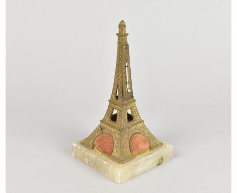 A Mid 20th Century French Souvenir Thermometer/Pin Cushion in the Form of a Gilt Eiffel Tower on Onyx Base, 14.5cms High, Con