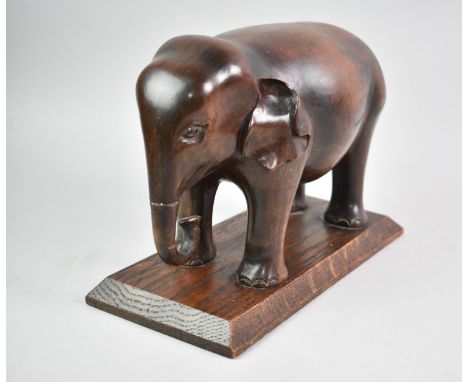 An Early 20th Century Carved Wooden Study of an Elephant on Rectangular Plinth, Trunk Glued, 29ms Long