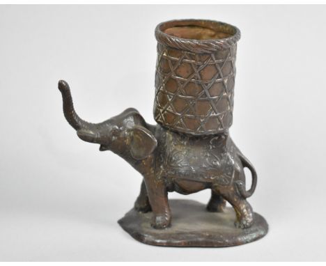 A Bronzed White Metal Novelty Match Holder in the Form of an Elephant with Trunk in Salute, 11.5cms High