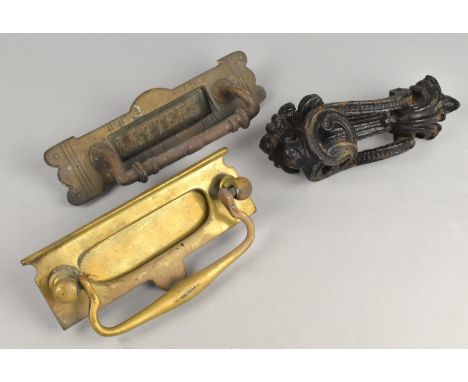 A Cast Metal Door Knocker and Two Brass Letter Flaps Etc