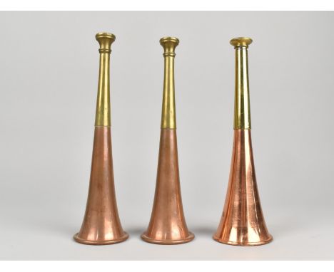 A Collection of Three Vintage Copper And Brass Hunting Horns