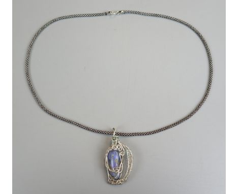 Australian opal wired pendant on silver chain