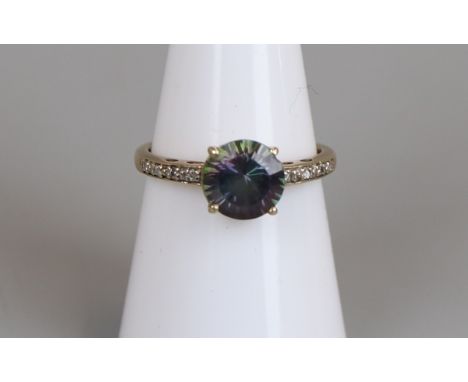 Gold mystic topaz set ring with diamond set shoulders, size M¾