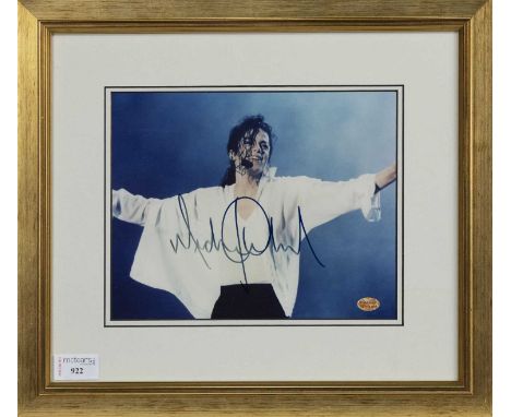 MICHAEL JACKSON AUTOGRAPHED PHOTOGRAPH,mounted, framed and under glass, with certificate to reverse, 36cm x 41cm