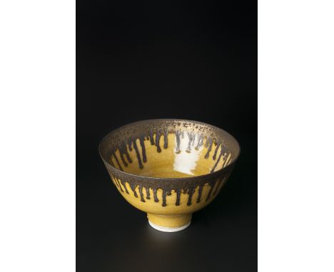 Lucie Rie (British, 1902-1995) Footed bowl in mustard yellow glaze, with running manganese rim impressed potter's seal 11.3cm
