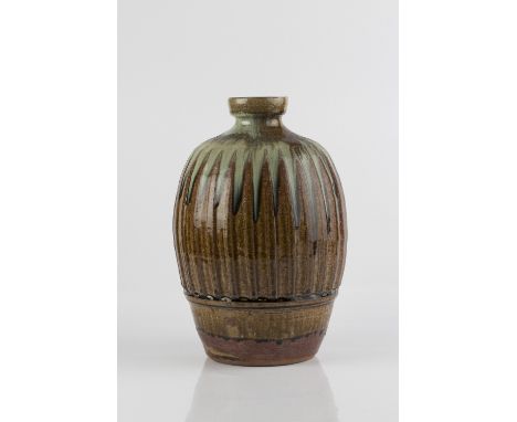 Mike Dodd (British, b.1943) Vase ash glaze, fluted sides impressed potter's seal 28cm high.