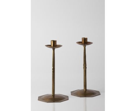 Russell & Son Pair of Arts & Crafts 'Lygon' brass candlesticks manufactured in the Lygon Arms Workshops, Broadway faceted ste