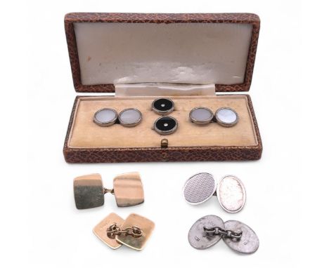 Three pairs of cufflinks. A pair of hallmarked 9ct plain gold cufflinks, a pair of hallmarked silver cufflinks with engine tu
