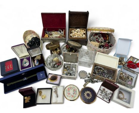 Several jewellery and trinket boxes containing a large quantity of costume jewellery, a Swarovski bracelet with purple crysta