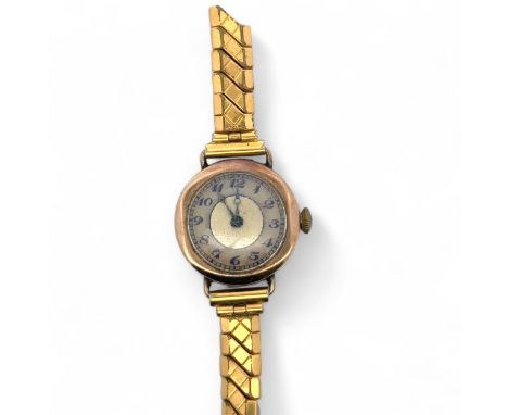 A 9ct gold 15 jewel watch on broken Excalibur bracelet. Unsigned dial. Hallmarks to inner Dennison case.