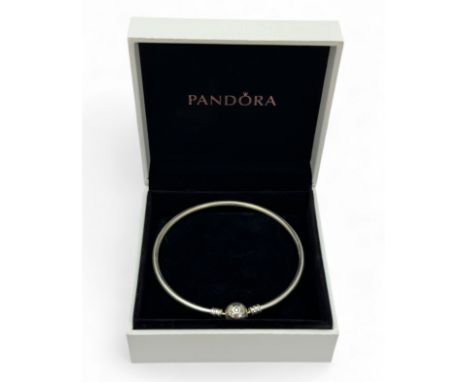 A Pandora silver bangle in original box.