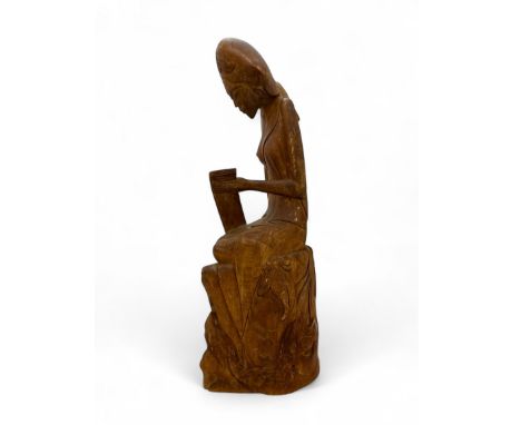 Balinese carved wooden sculpture of a seated lady signed IWAJANWIRI MAS BALI to base. Height 37cm. 