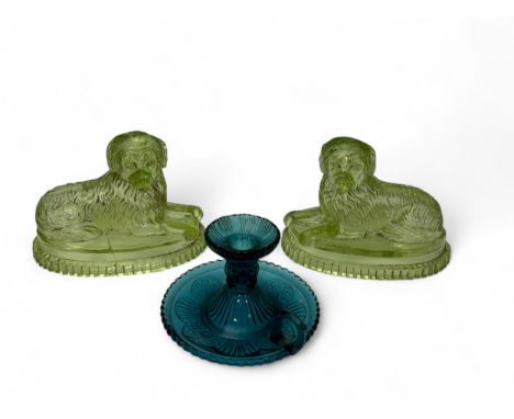 A pair of John Derbyshire uranium glass dogs (one with significant crack), along with a blue pressed glass "goodnight" chambe