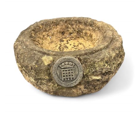 Rough hewn stone trough with label stating 'This stone came from the Houses of Parliament', approx. 30cm diameter x 12cm heig