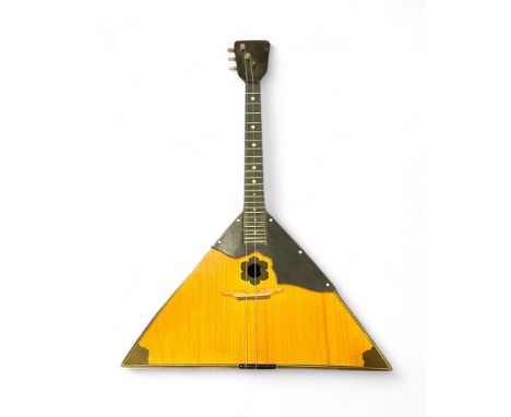 A Balalaika with a lakeside city view painted to back. Russian inscription to back metal plate. Total length approximately 65