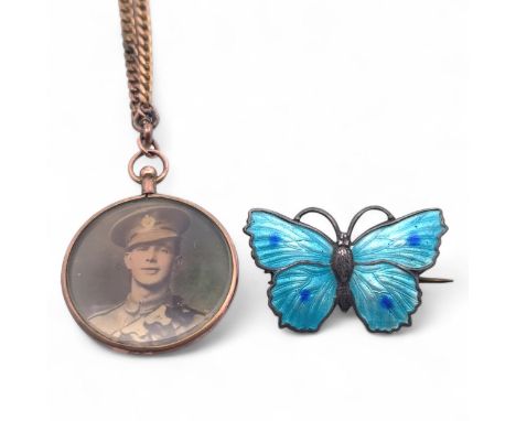 A silver &amp; enamel butterfly brooch stamped sterling to reverse, and a picture frame pendant stamped 9ct on a yellow metal