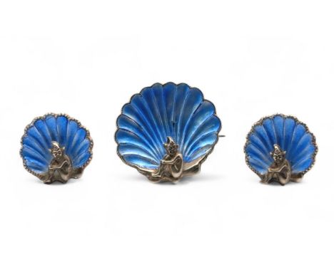 A vintage silver and blue enamel pixie in a scallop shell brooch, with matching clip on earrings. Unsigned, likely Bernard In