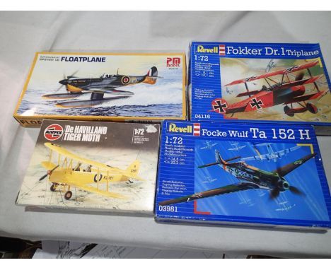 Four 1/72 scale aircraft kits, Airfix Tiger Moth, BP Kits Spitfire Floatplane, and Revell Focker triplane and FW TA152H, appe