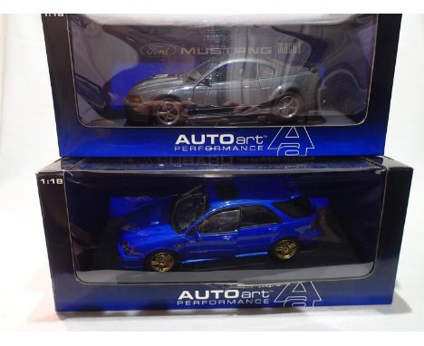 Two Auto Art 1/18 scale cars, Ford Mustang Mach 1 2004 40th Anniversary model and Subaru New Age Impreza WRX STI, both near m