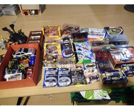 Twenty five boxed/carded vehicles, metal and plastic, various makes and types, mostly mint, wear to boxes, plus a selection o