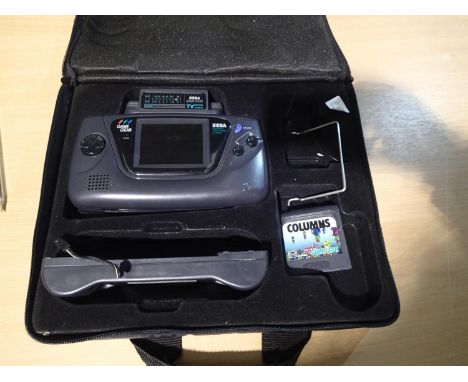 Sega Game Gear with TV tuner, powergrip and columns game with case and master system convertor. Power light comes on but no i