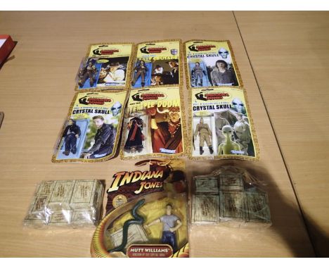 Six Indiana Jones figures, including six replica Kenner in reprint packets, and two packs of ten crates, wear to boxes. UK P&