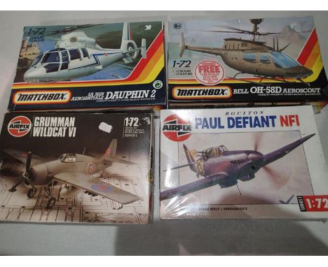 Four 1/72 scale aircraft kits, Matchbox Bell Aeroscout Heli and Dauphin Heli, and Airfix DP Defiant and Wildcat, appear compl