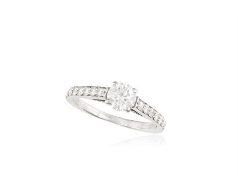 A DIAMOND SINGLE-STONE RINGThe round brilliant-cut diamond, weighing approximately 0.60ct, within pavé-set round brilliant-cu