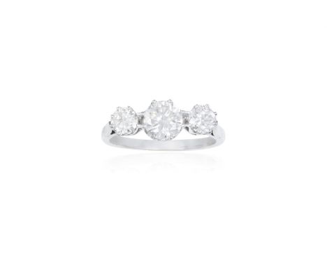A DIAMOND THREE-STONE RINGThe central round brilliant-cut diamond weighing approximately 0.70ct, between similarly-cut diamon