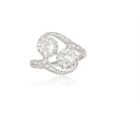 AN EARLY 20TH CENTURY DIAMOND CROSS-OVER RINGThe two old brilliant-cut diamonds to rose-cut diamond obliquely-set shoulders, 