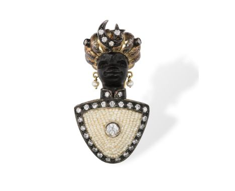 A GEM-SET BLACKAMOOR BROOCH, CIRCA 1955The carved ebony head of a man, the tunic accented by round brilliant-cut diamonds and