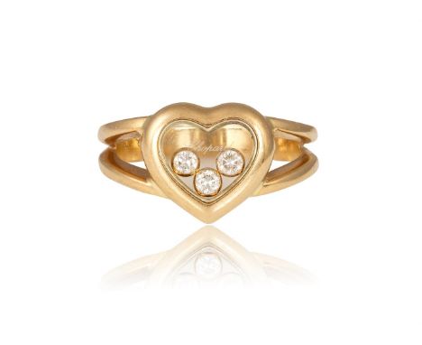 A HEART-SHAPED 'HAPPY DIAMOND' RING, BY CHOPARDThe glazed heart-shaped compartment enclosing three collet-set diamonds, betwe