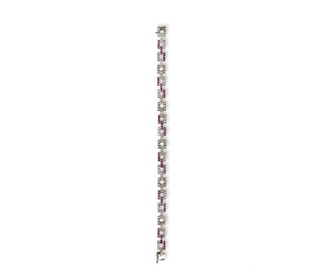 AN EARLY 20TH CENTURY RUBY, DIAMOND AND PEARL BRACELETThe brick-link bracelet, set throughout with rose-cut diamonds and squa