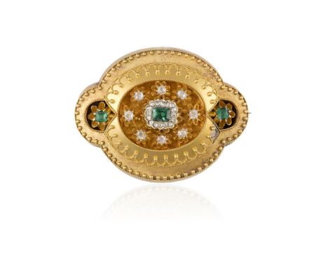 A VICTORIAN EMERALD AND DIAMOND BROOCH, CIRCA 1860Of Etruscan Revival style, the centre section set with a cluster of emerald