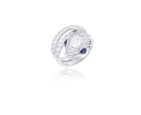 A DIAMOND AND SAPPHIRE RING, BY PEDERZANIDesigned as a coiled snake, the body set with round brilliant-cut diamonds, accented