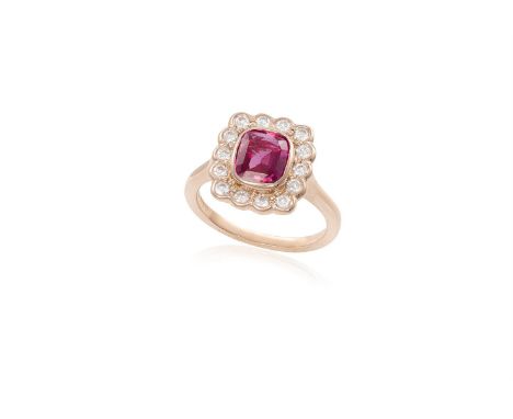 A RUBY AND DIAMOND CLUSTER RINGThe collet-set cushion-shaped ruby, weighing 1.66cts, within a surround of round brilliant-cut