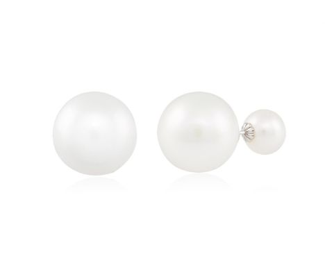 A PAIR OF CULTURED PEARL EARRINGSThe round-shaped South Sea cultured pearl of white tint measuring approximately 13.09x13.40m