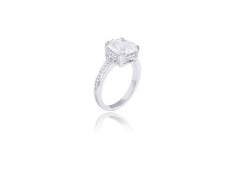 A FINE SINGLE-STONE DIAMOND RINGThe round brilliant-cut diamond weighing 3.32cts, within a four-claw setting, the hoop and ga
