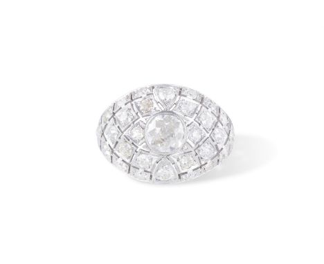 A DIAMOND DRESS RINGOf bombé design, set centrally with an old brilliant-cut diamond weighing approximately 0.85ct, to a pier