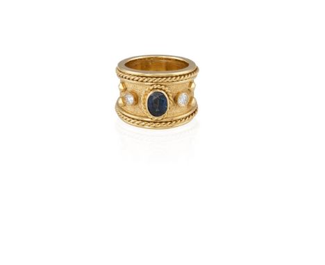 A SAPPHIRE AND DIAMOND DRESS RINGThe brushed gold band highlighted by a collet-set oval-shaped sapphire between two brilliant