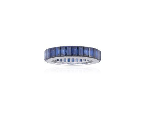 A SAPPHIRE AND ETERNITY RING, BY FAVEROSet with a continuous row of baguette-cut sapphires weighing 6.81cts total, within mys