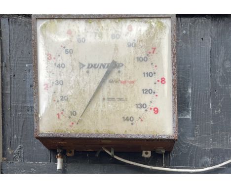 An early Dunlop air pressure gauge, 35 x 39cm.