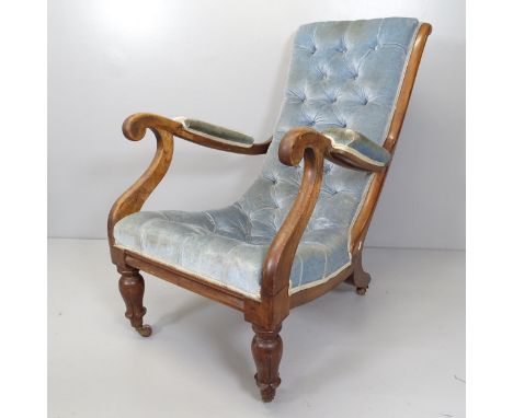 A William IV mahogany and upholstered button-back open arm chair. 