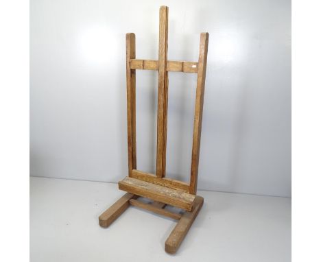 An antique oak adjustable artist's easel. 