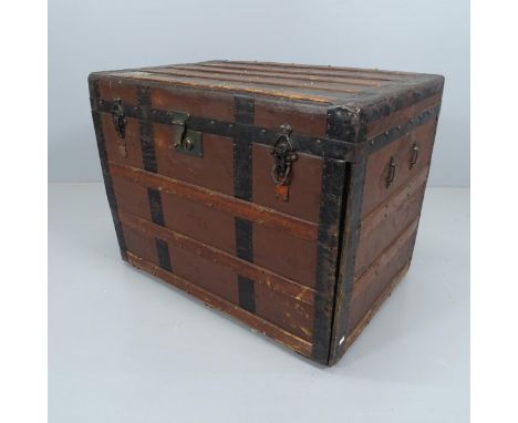 A late 19th/early 20th century steamer trunk, the fall front revealing drawers. 77x59x52cm. 