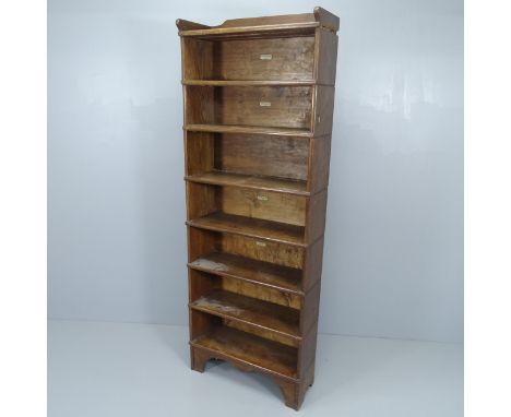 An early 20th century oak seven-shelf Globe Wernicke sectional open bookcase. With maker's label. 69x191x28cmTop section has 